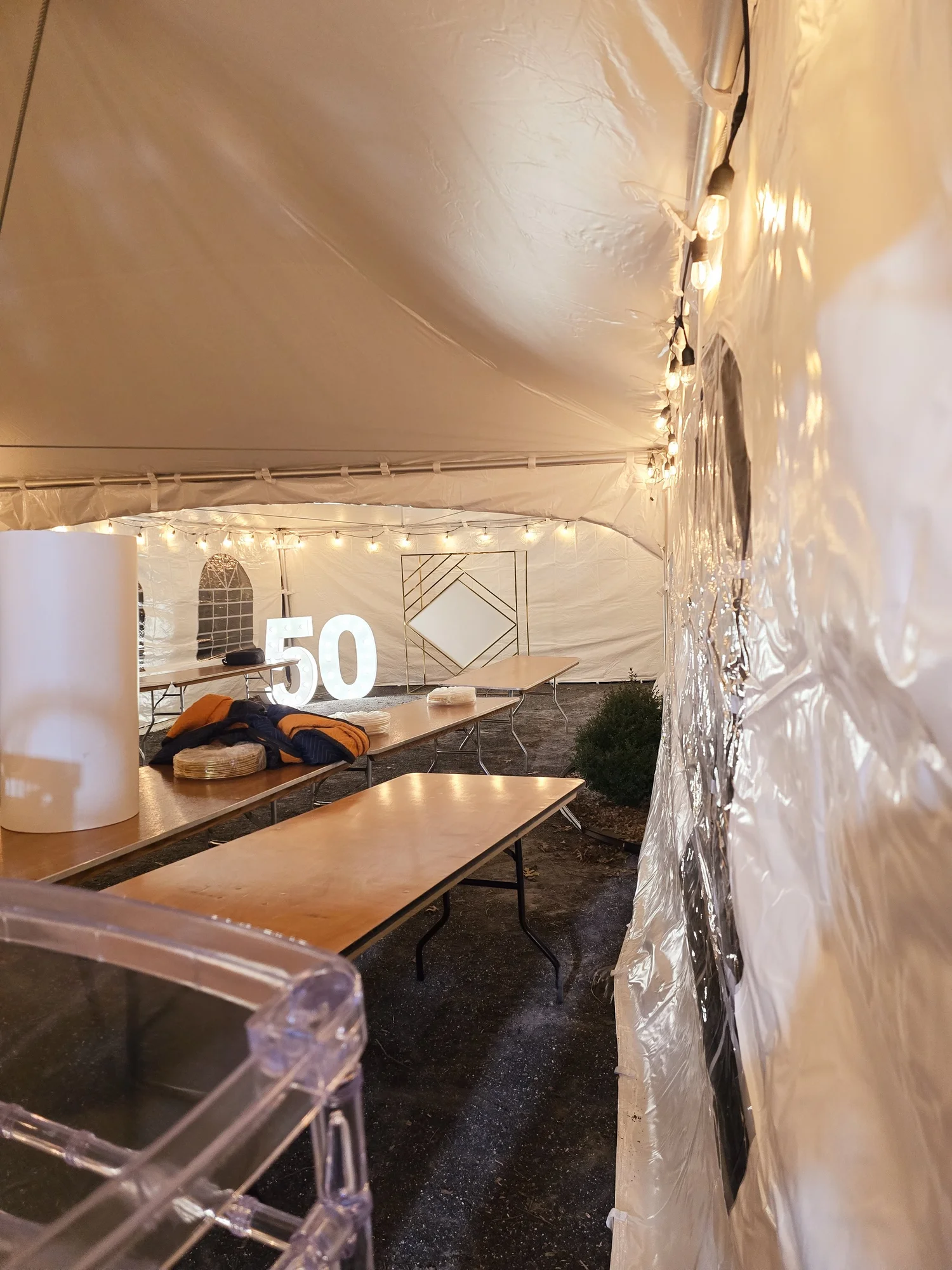 Frame tent installation for outdoor wedding